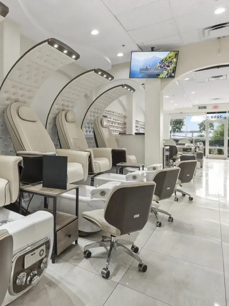 Row of luxury pedicure spa chairs at Trust Nails & Spa in Kissimmee
